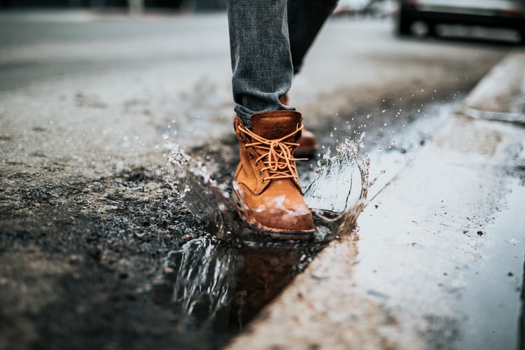 Stepping in puddles results in water seeping through the thin soles into the leather shoe