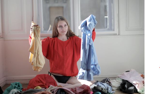 Woman holding her clothes