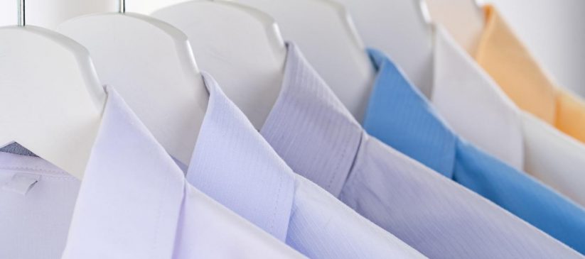 Male formal shirts hanging on a clothes hanger