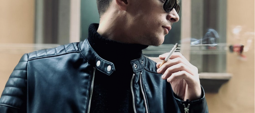 man-in-black-leather-jacket-smoking