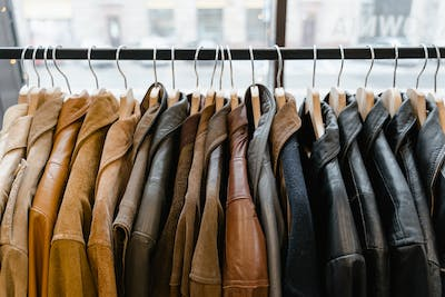 Leather and Suede jackets hanging on a rack