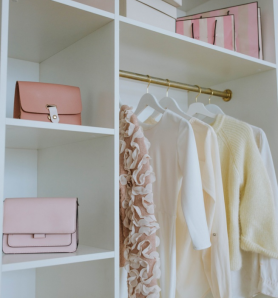 A neatly organized and color-coordinated closet and shelves