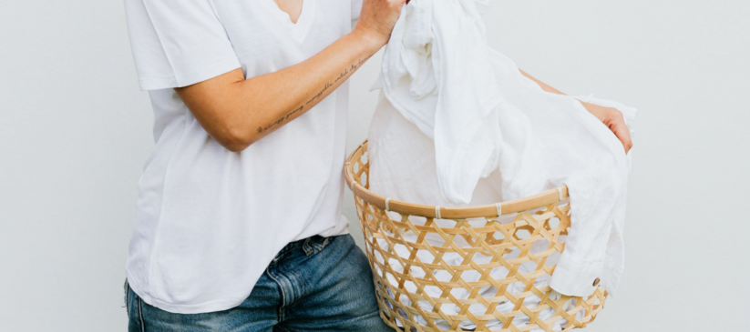 a picture of woman holding laundry basket