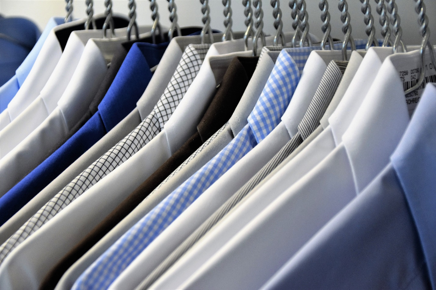 Office shirts neatly ironed and hung.